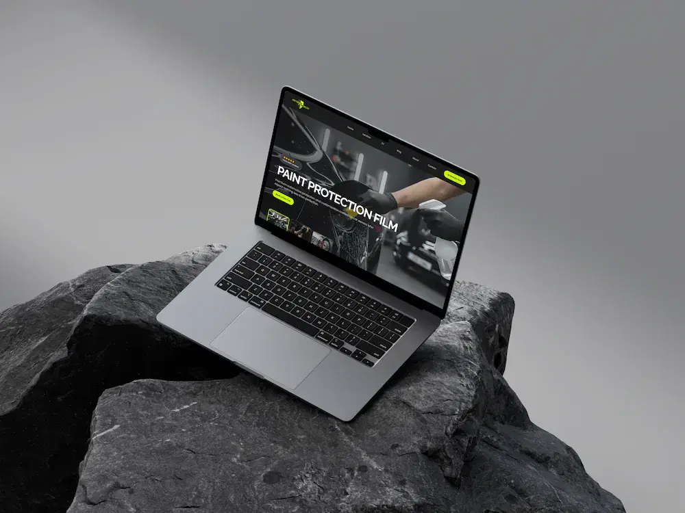 Speed Shield’s website displayed on a laptop resting on a rock