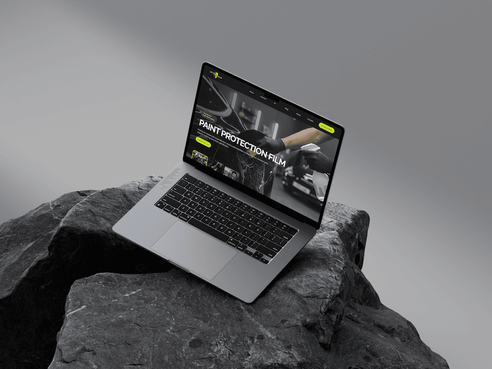 Speed Shield’s website displayed on a laptop resting on a rock